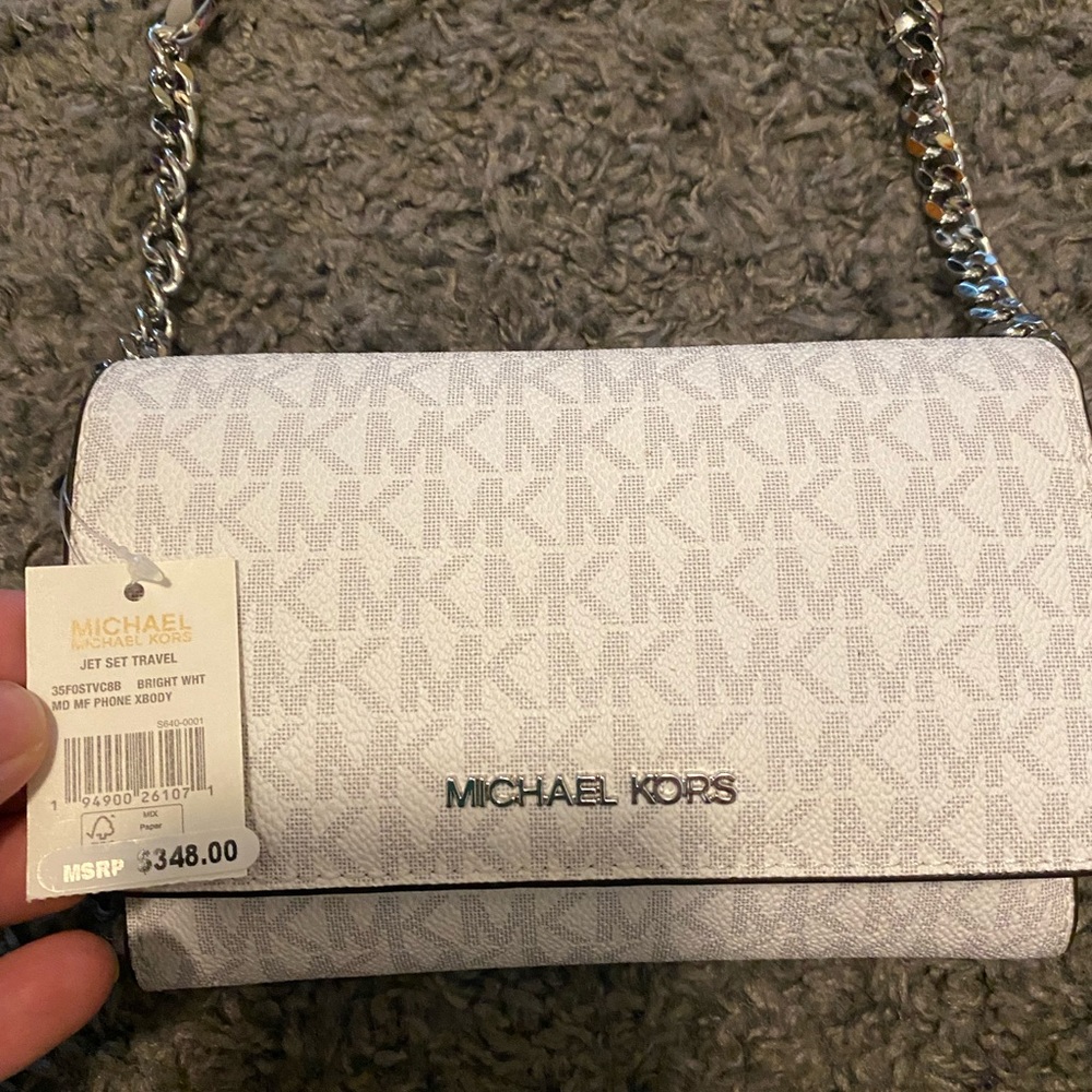 Brand new with tags. Michael Kors Crossbody bag. Super cute perfect gift